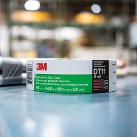 A roll of 3M™ Heavy Duty Duct Tape DT11 sitting on a counter.